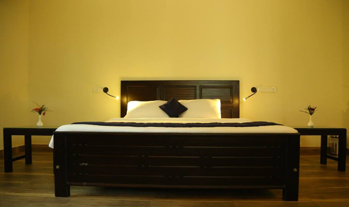 Spacious classic cottage room at Yamunatheeram nature retreat