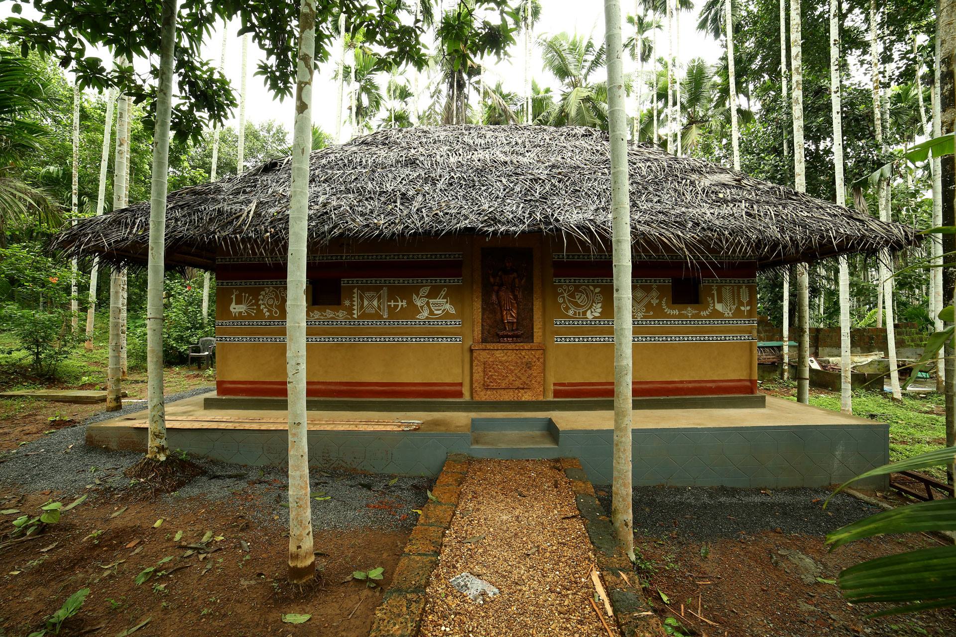 Ayurvedic spa treatment room at Yamunatheeram Wellness Centre Kerala with traditional oils and herbal setup